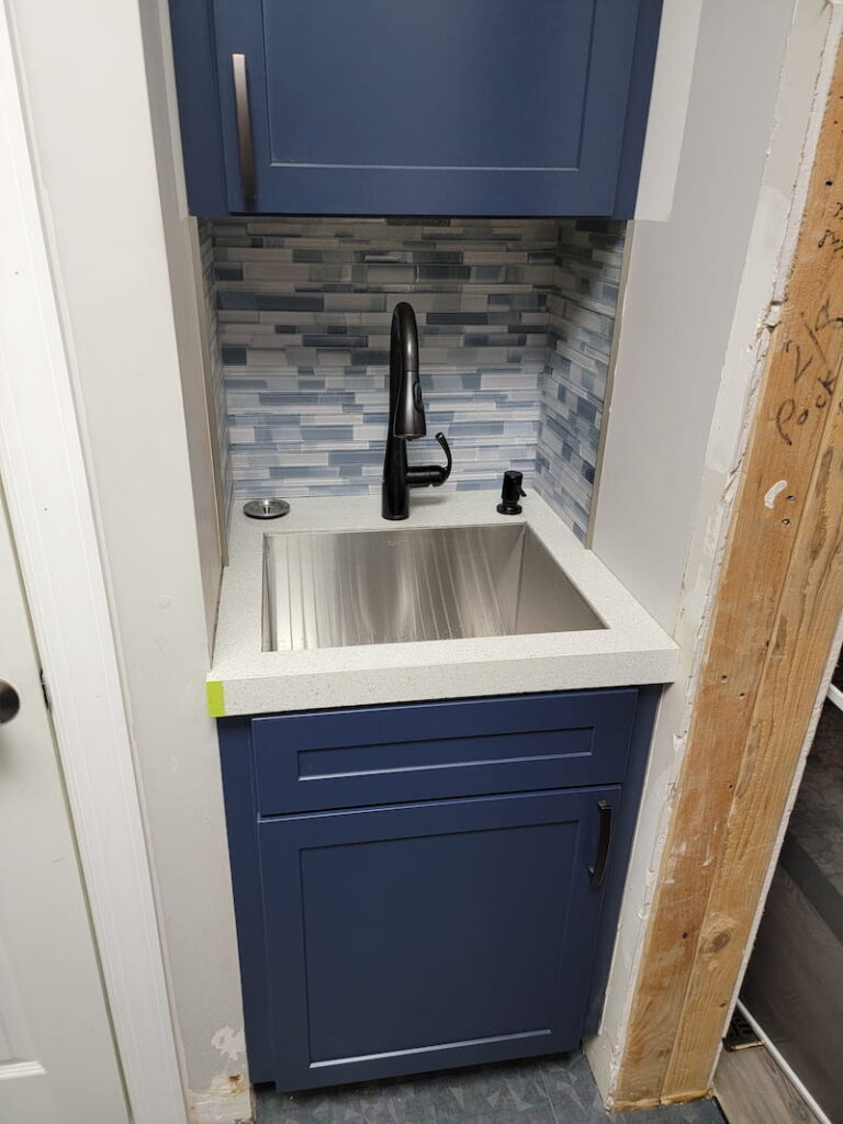 Laundry room sink with backsplash installed